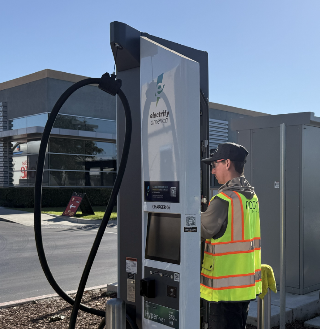 Noch technician servicing a commercial DC fast charger in California.