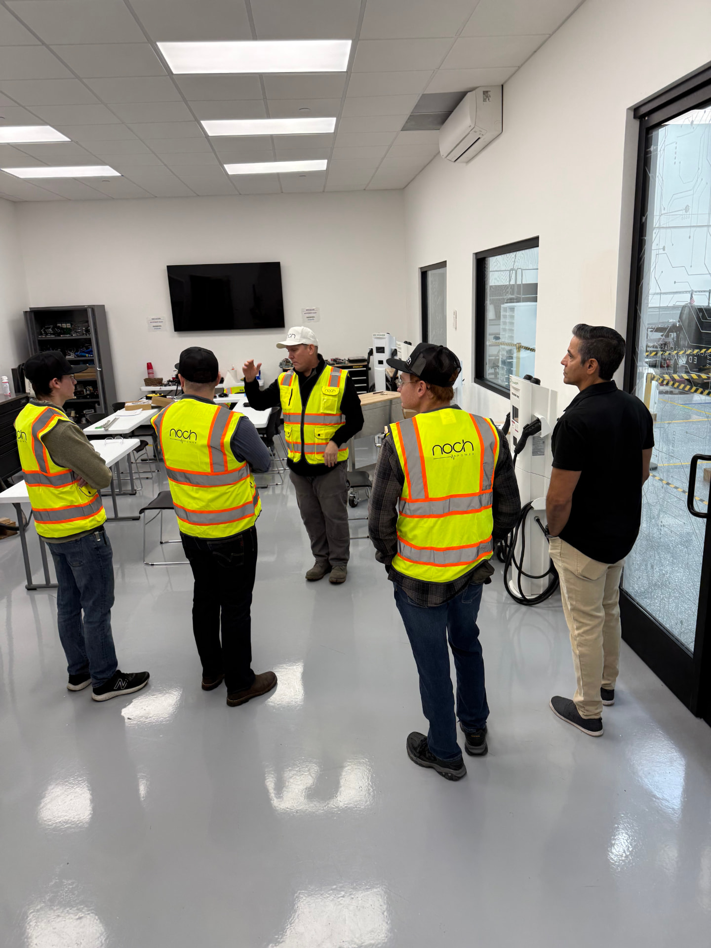 Noch technicians in a training briefing at the facility